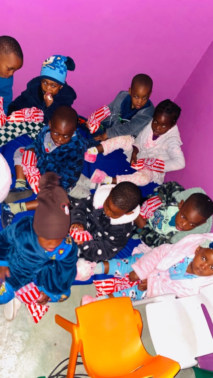 Children gathered together on mats in the morning